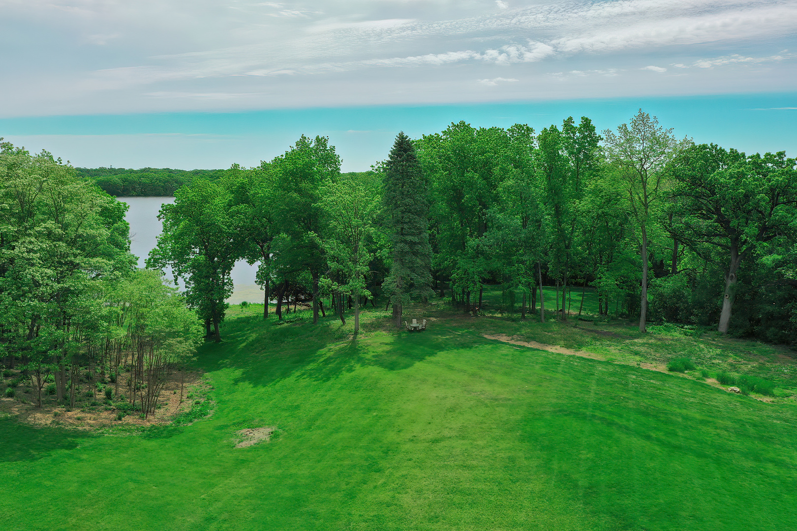 26813 North Chevy Chase Road Mundelein, IL 60060 - Photo 6 of 15 a view of a big yard with green space and mountain in the back