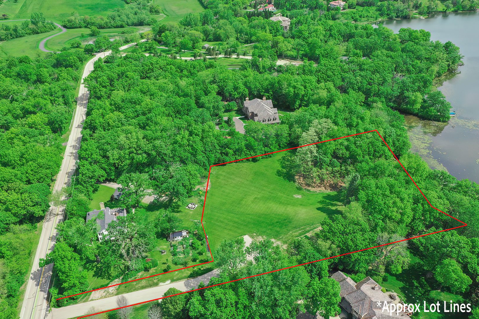 26813 North Chevy Chase Road Mundelein, IL 60060 - Photo 8 of 15 a view of a lush green forest with lawn chairs and plants