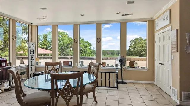 a view of a dining room with furniture window and outside view
