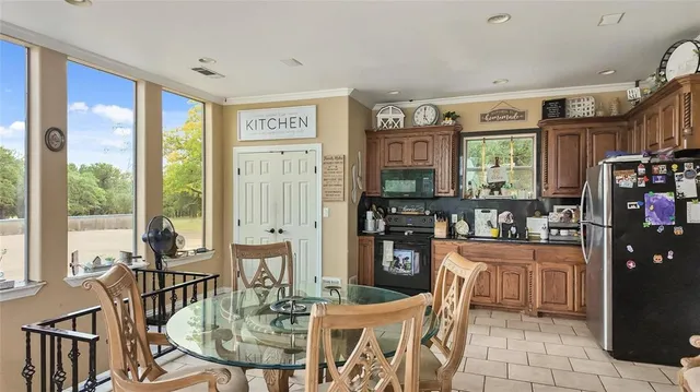 a dining room with furniture and window