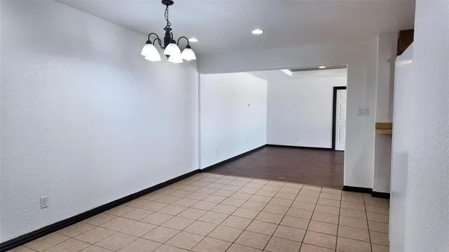 a kitchen with a refrigerator and a sink