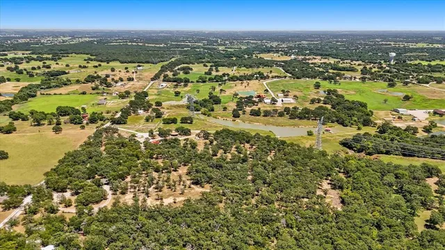 an aerial view of residential building and lake