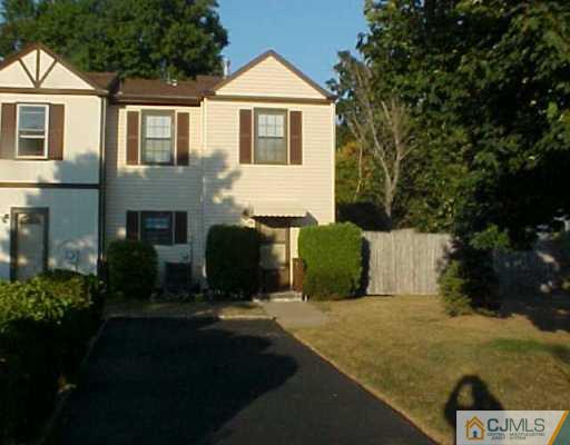 65 Redbud Road Piscataway, NJ 08854 - Photo 1 of 2 a front view of a house with yard