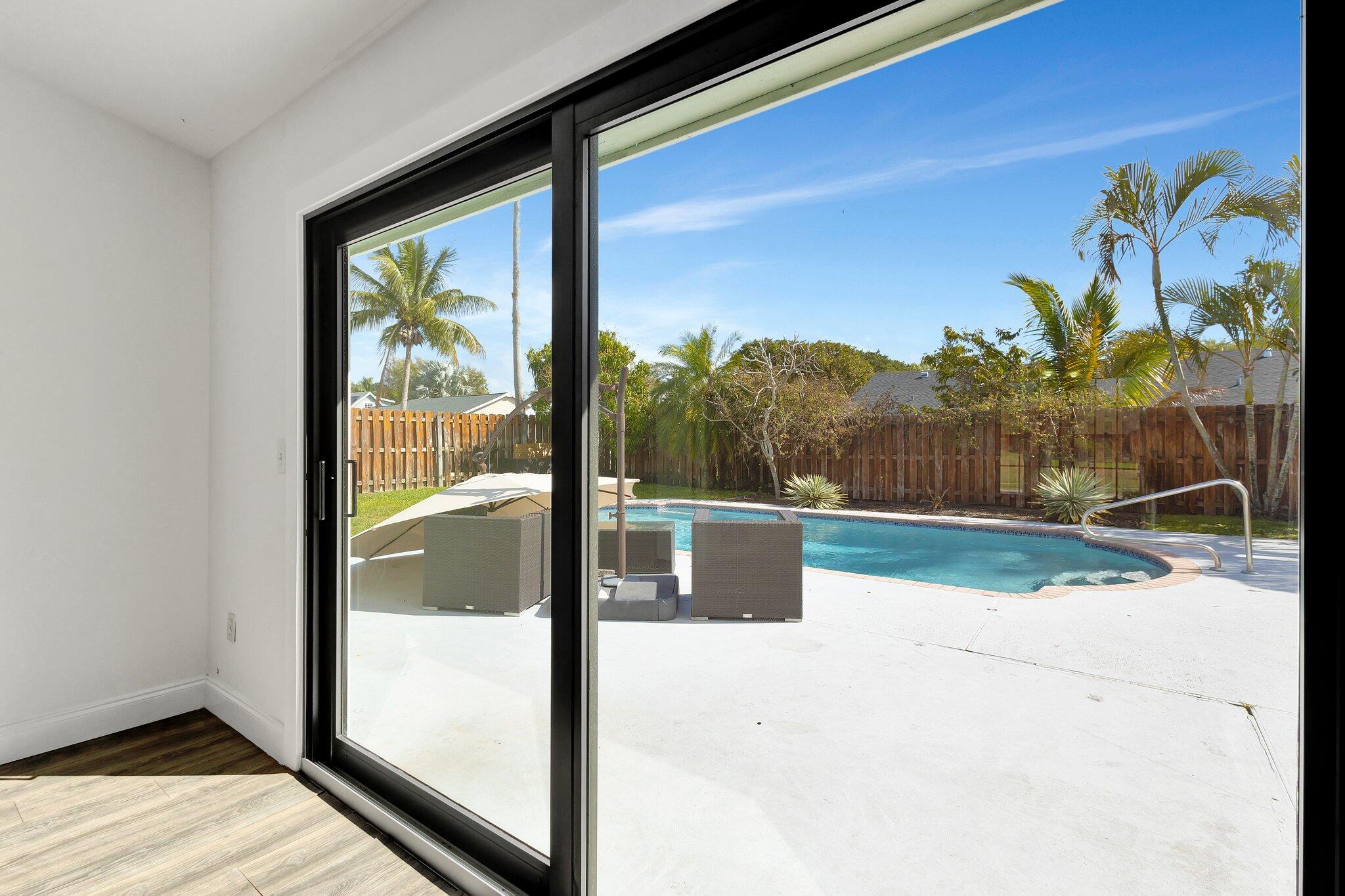 9404 Longmeadow Circle Boynton Beach, FL 33436 - Photo 15 of 28 a view of a porch