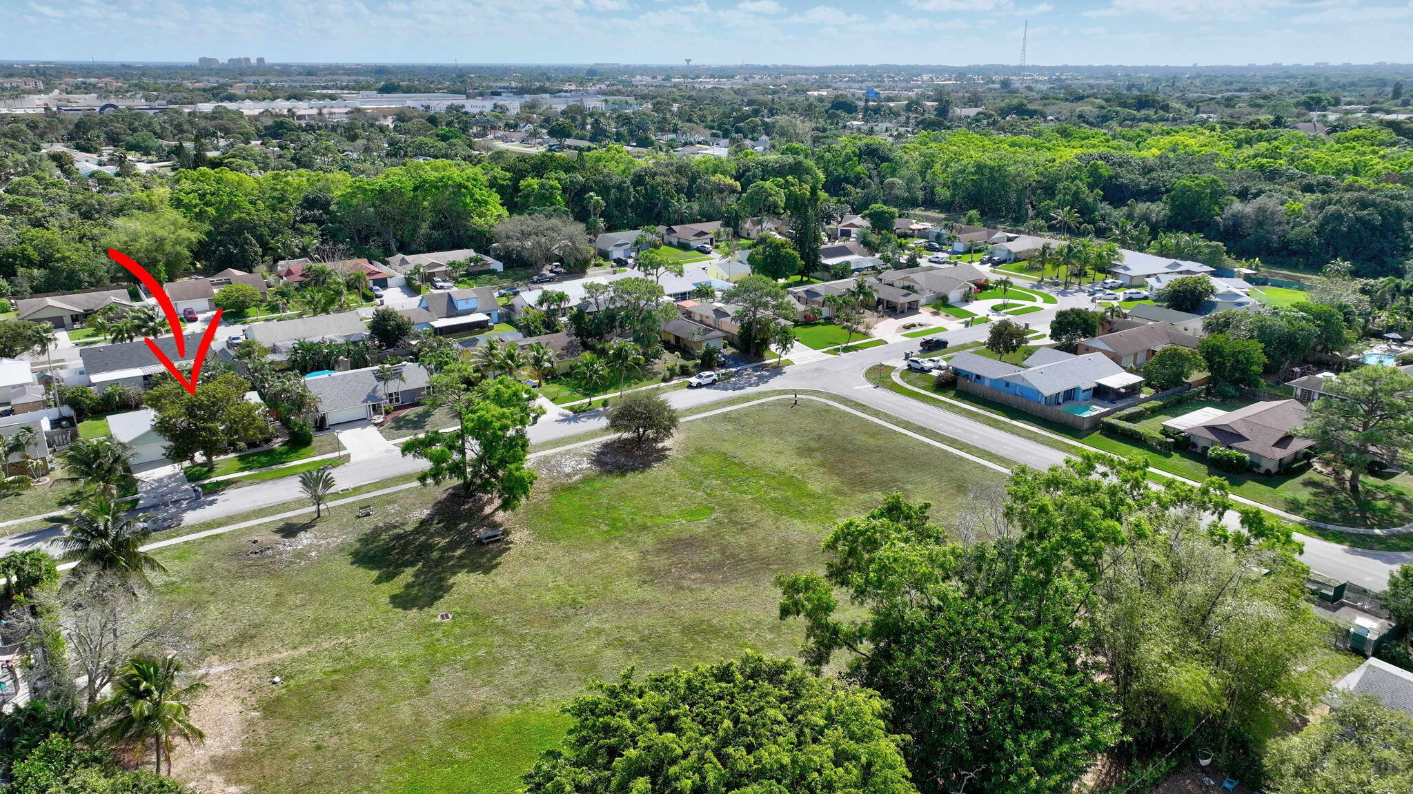 9404 Longmeadow Circle Boynton Beach, FL 33436 - Photo 28 of 28 an aerial view of residential houses with outdoor space and trees