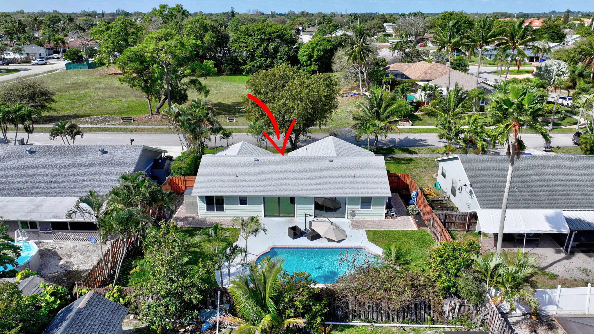 9404 Longmeadow Circle Boynton Beach, FL 33436 - Photo 3 of 28 an aerial view of a house with a yard and lake view
