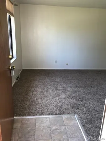 a kitchen with a stove a refrigerator and a sink