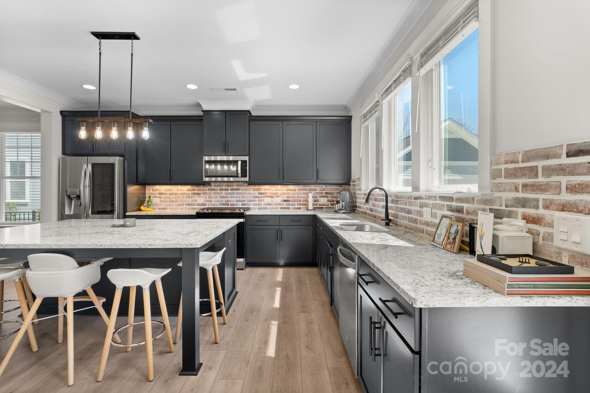 815 Bluff Loop Road Rock Hill, SC 29730 - Photo 11 of 35 a kitchen with granite countertop a sink a counter space appliances and cabinets