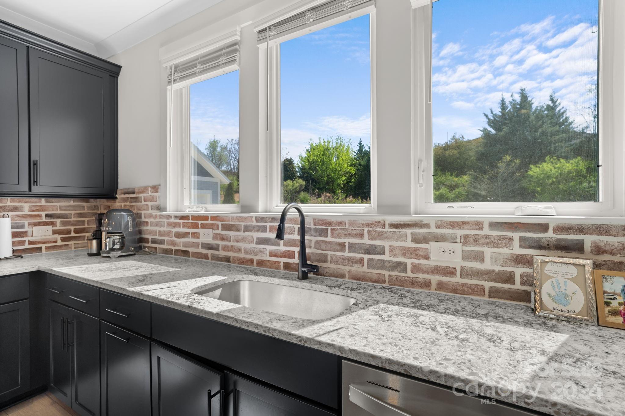 815 Bluff Loop Road Rock Hill, SC 29730 - Photo 13 of 35 a kitchen with granite countertop a sink and a window