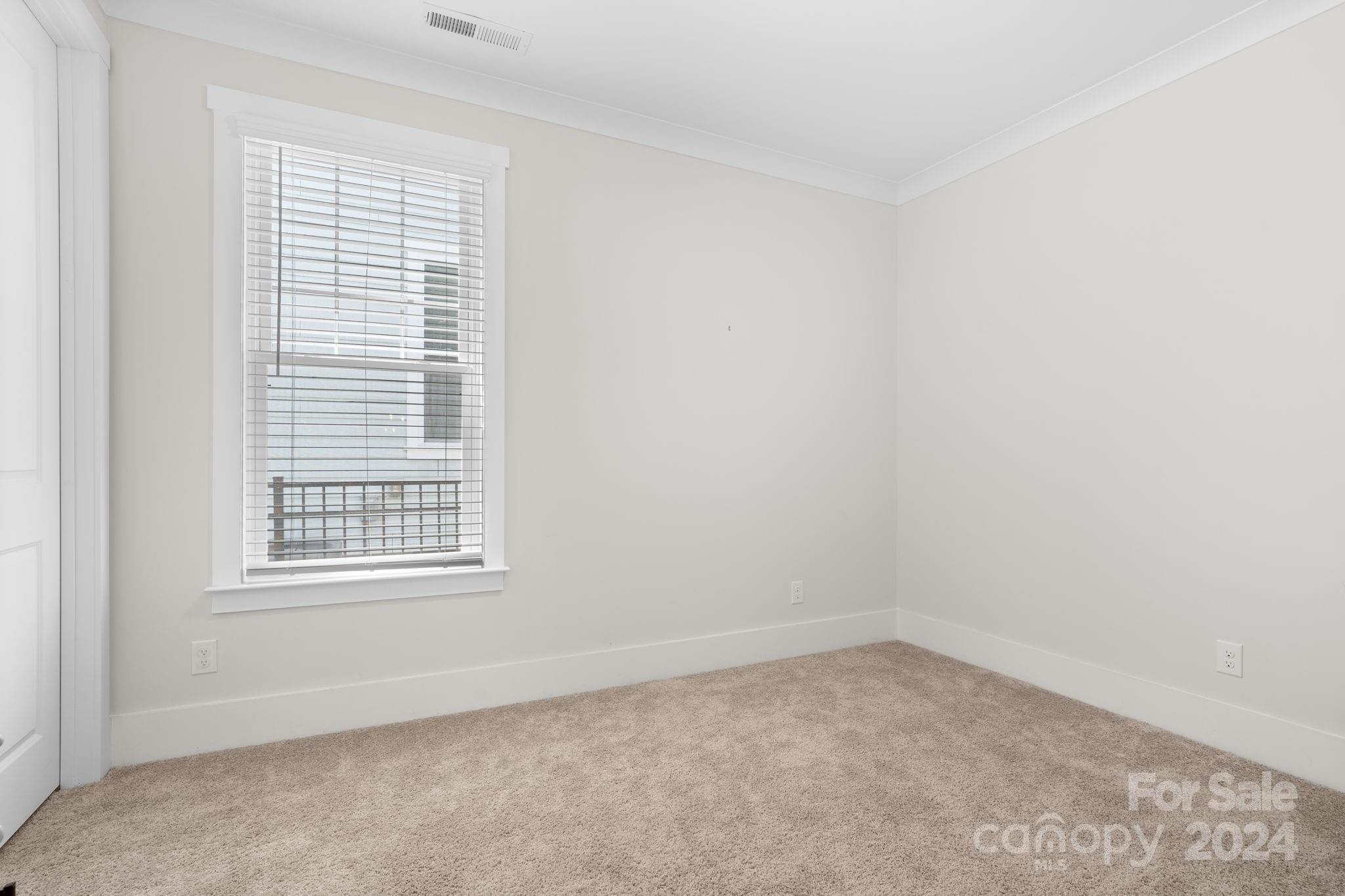 815 Bluff Loop Road Rock Hill, SC 29730 - Photo 18 of 35 an empty room with a window