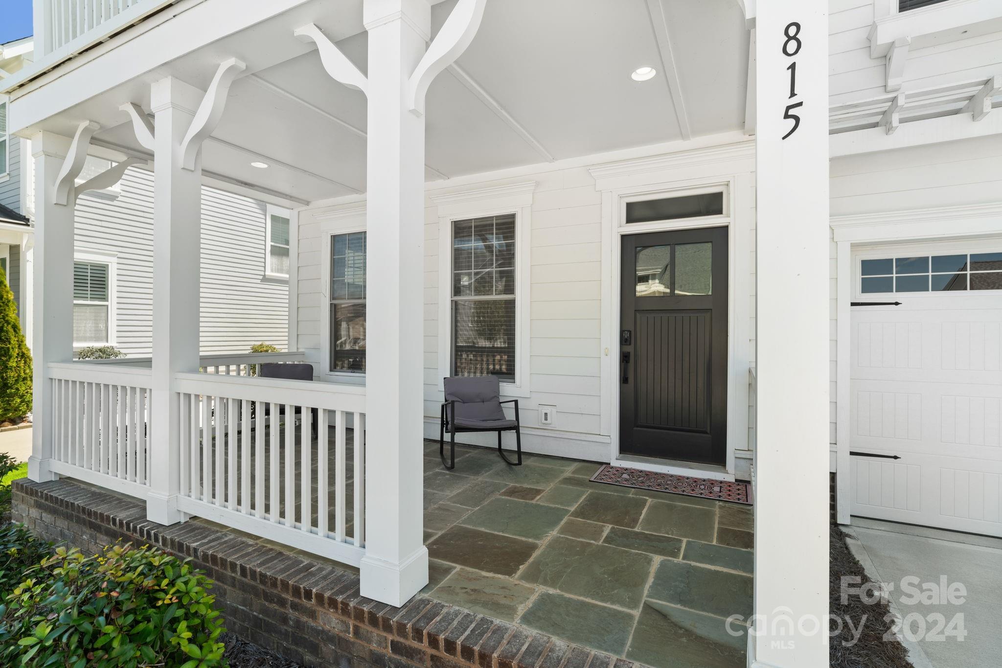 815 Bluff Loop Road Rock Hill, SC 29730 - Photo 2 of 35 a view of a porch with a table and chairs