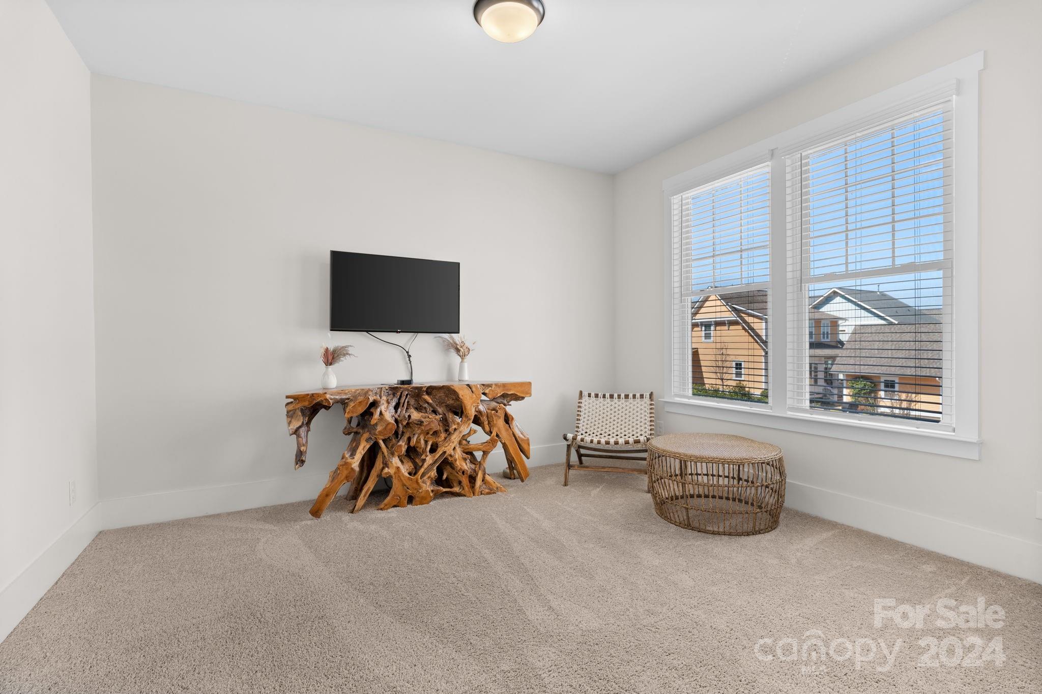 815 Bluff Loop Road Rock Hill, SC 29730 - Photo 22 of 35 a bed room with furniture and a flat screen tv