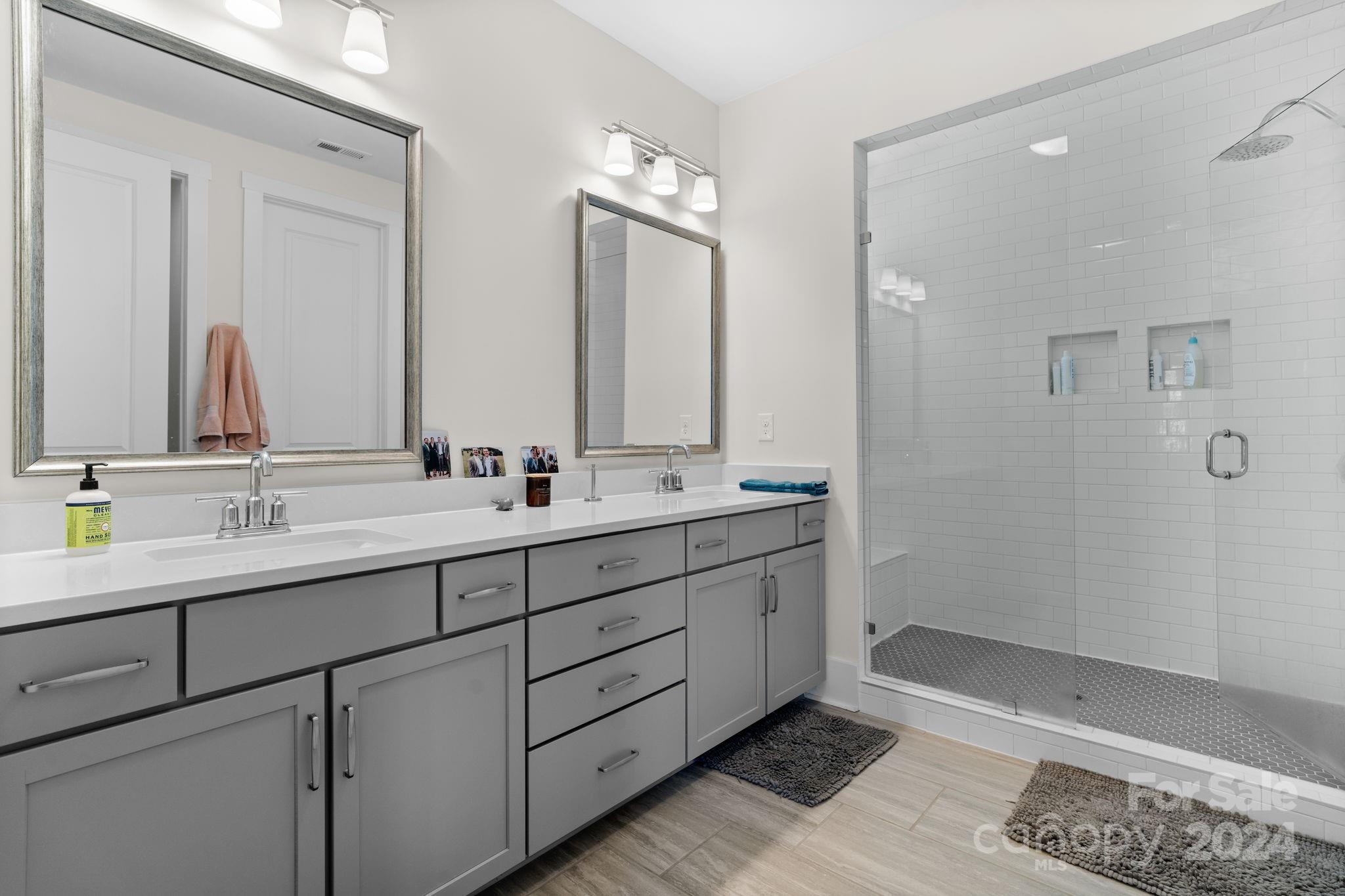 815 Bluff Loop Road Rock Hill, SC 29730 - Photo 26 of 35 a bathroom with double vanity sinks and a mirror