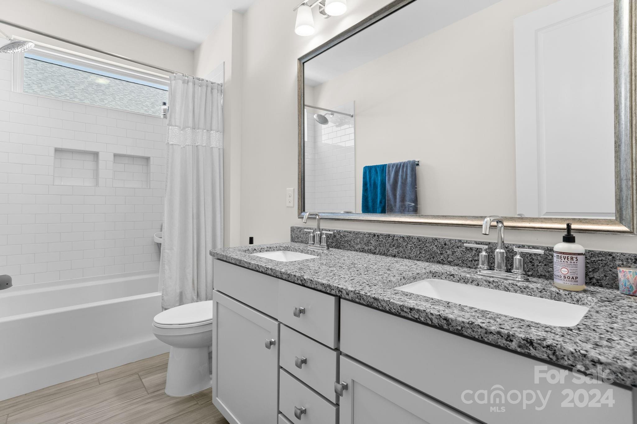 815 Bluff Loop Road Rock Hill, SC 29730 - Photo 32 of 35 a bathroom with a granite countertop sink toilet and shower