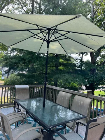 swimming pool view with a seating space