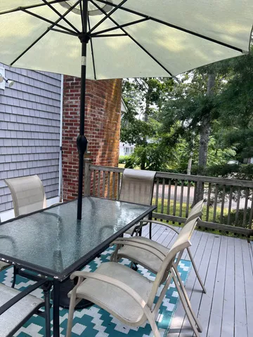 a balcony view with a seating space
