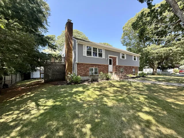 a front view of a house with a yard