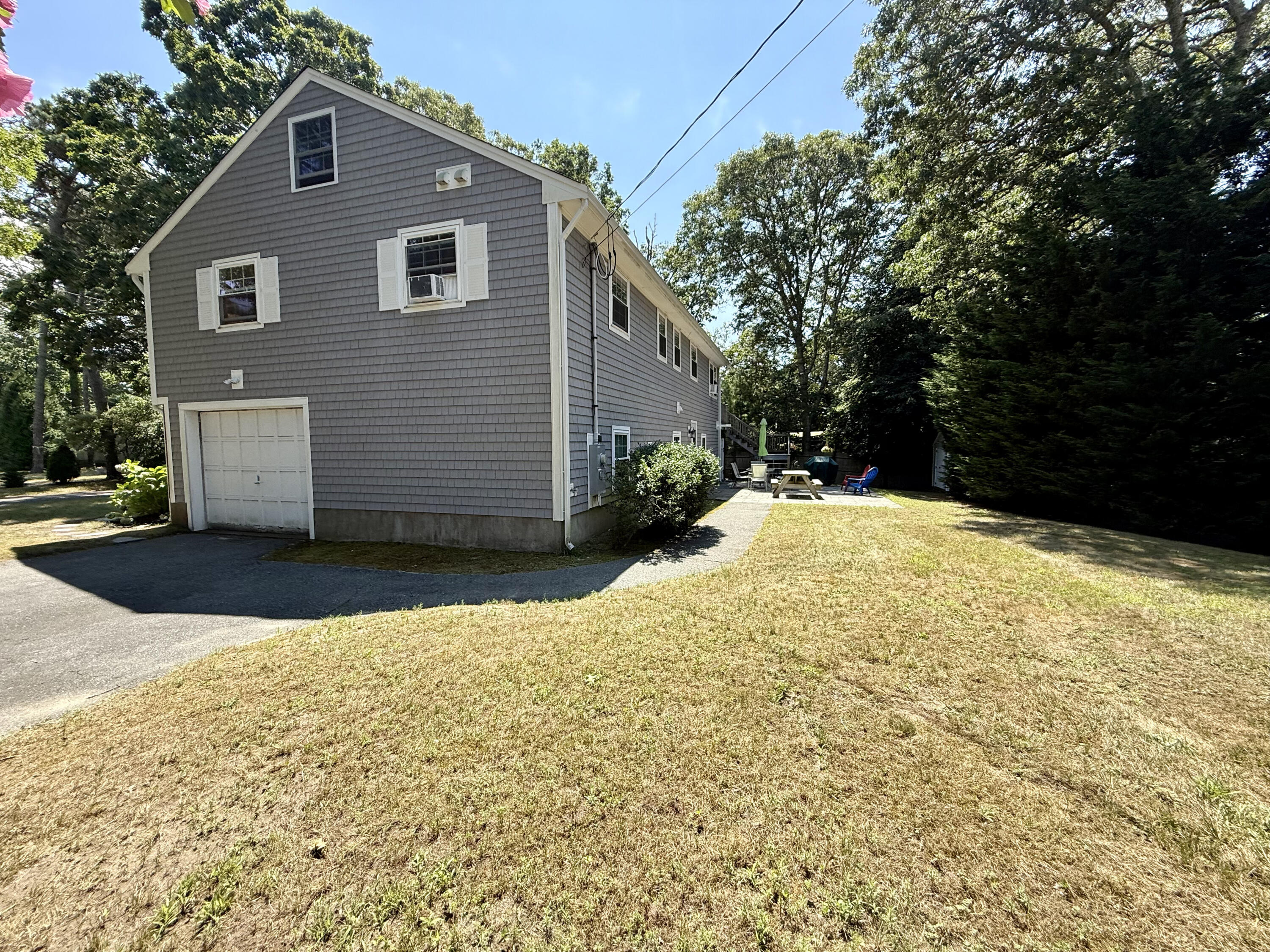 20 Trumet Road West Harwich, MA 02671 - Photo 5 of 21 a front view of a house with a yard