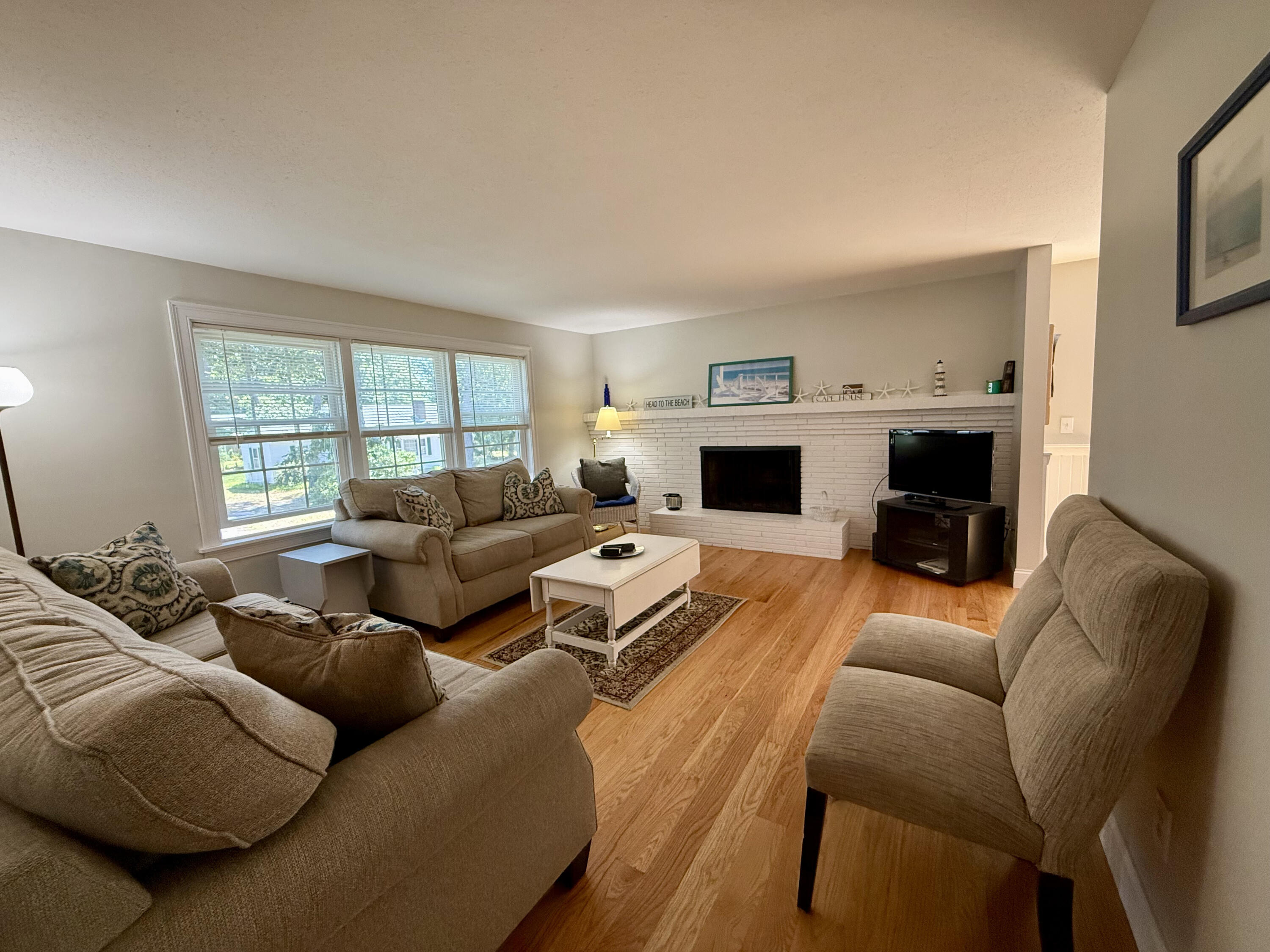 20 Trumet Road West Harwich, MA 02671 - Photo 9 of 21 a living room with furniture window and a fireplace