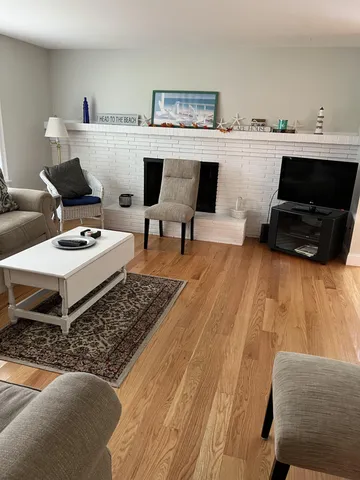 a living room with furniture and a rug