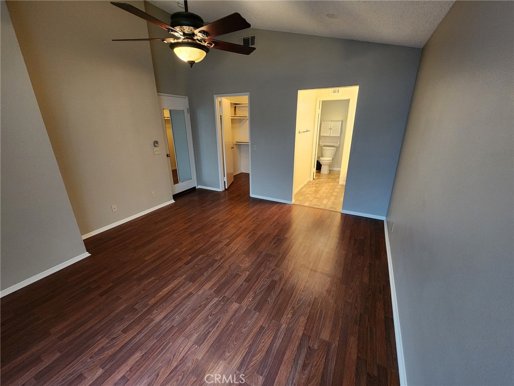 29806 Coral Tree Court Menifee, CA 92584 - Photo 12 of 29 wooden floor in an empty room with a window