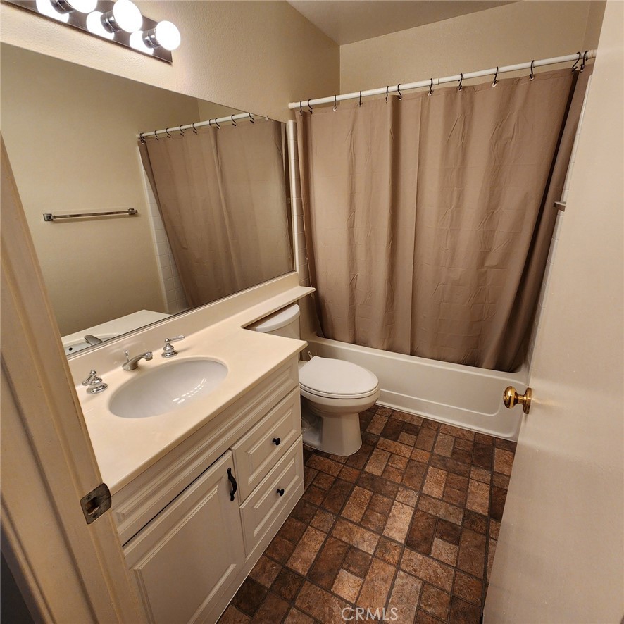 29806 Coral Tree Court Menifee, CA 92584 - Photo 22 of 29 a bathroom with a sink and a mirror