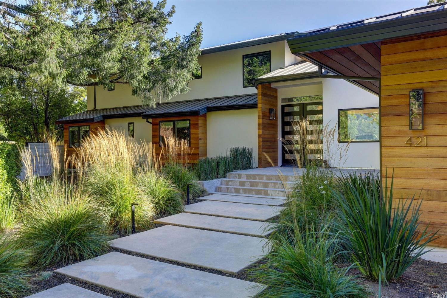 a front view of a house with garden