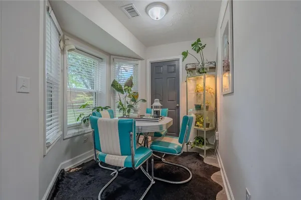 a view of a dining room with furniture window and outside view