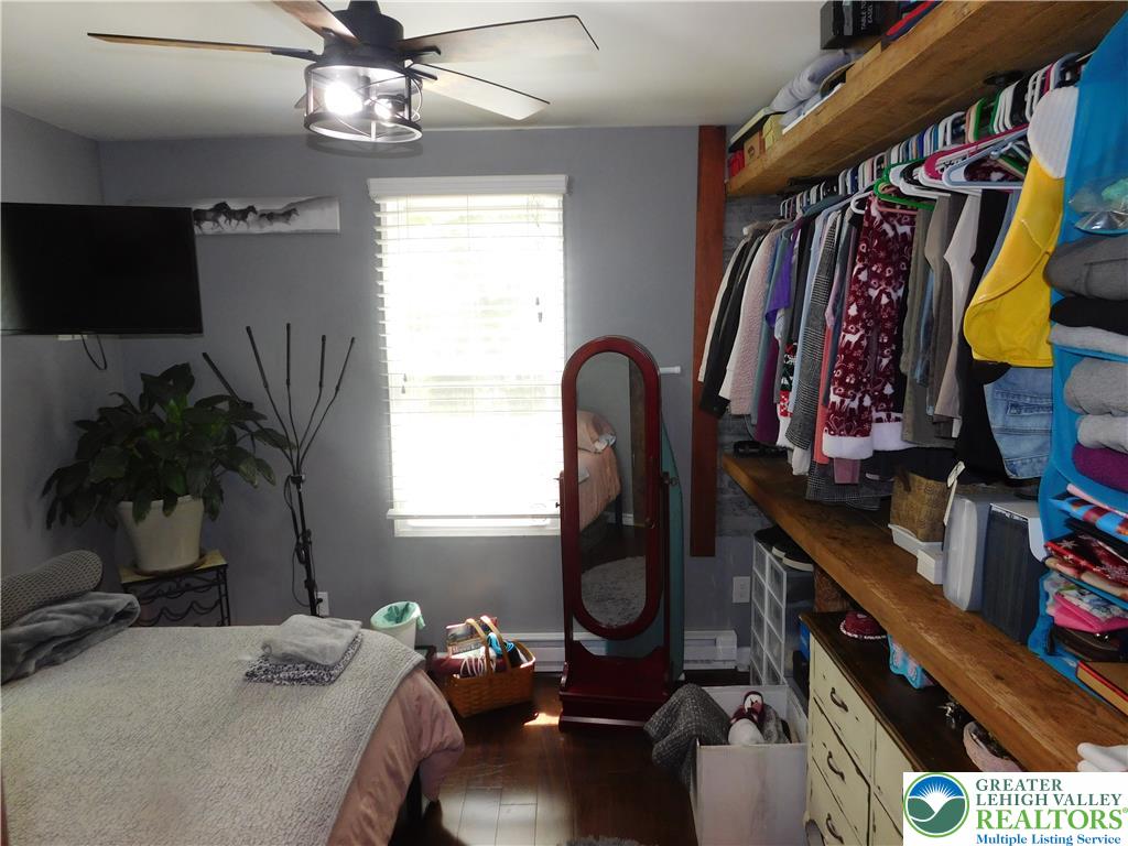 41 Reeder Street Mount Pocono, PA 18344 - Photo 26 of 41 Hardwood floors and built-in closet shelving define this comfortable bedroom space.