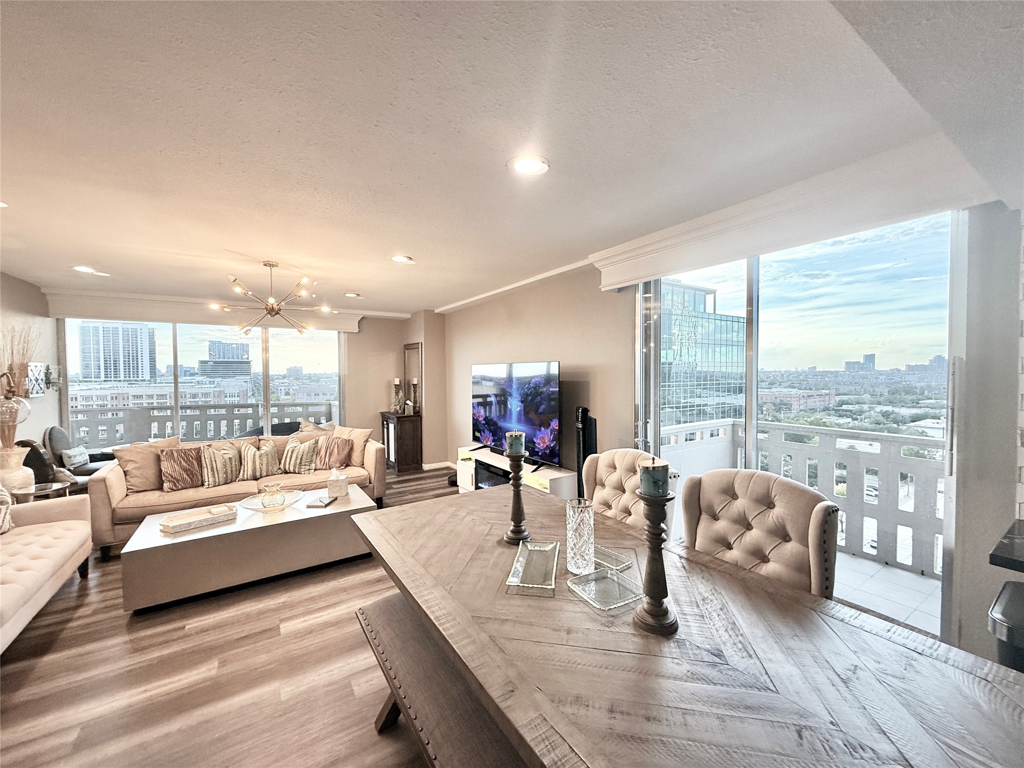 2016 Main Street, Unit 1022 Houston, TX 77002 - Photo 2 of 48 a living room with furniture and a large window