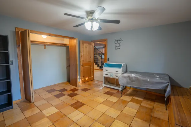 a view of an empty room with a kitchen