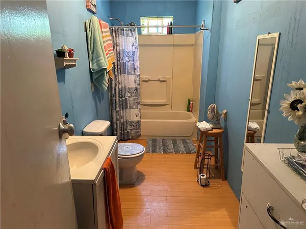 a room with a refrigerator and washer
