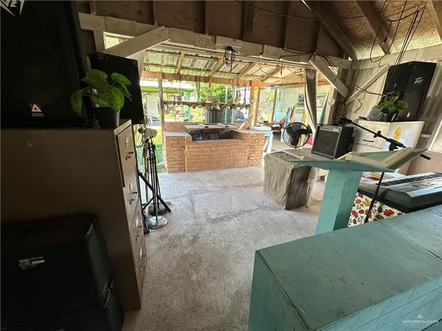 a living room with blue lights with furniture