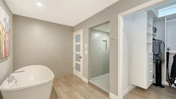 a bathroom with a toilet and a shower