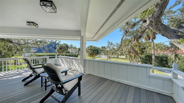 a view of a balcony with furniture