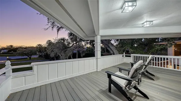 a view of a two chairs in the balcony