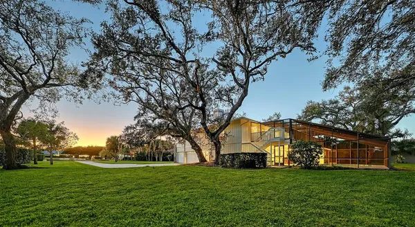 a view of a big yard next to a house