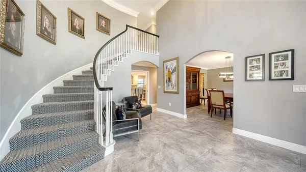 a view of entryway and hall with dining room
