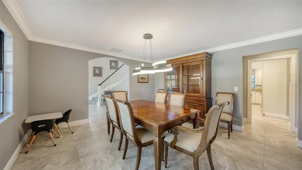 a dining room with furniture and window