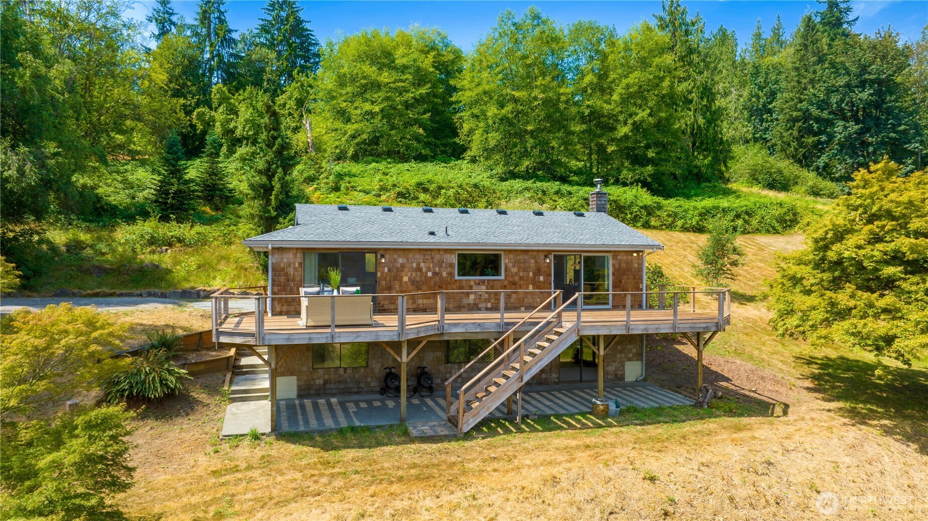 22212 High Bridge Road Monroe, WA 98272 - Photo 1 of 34 an aerial view of a house with swimming pool table and chairs