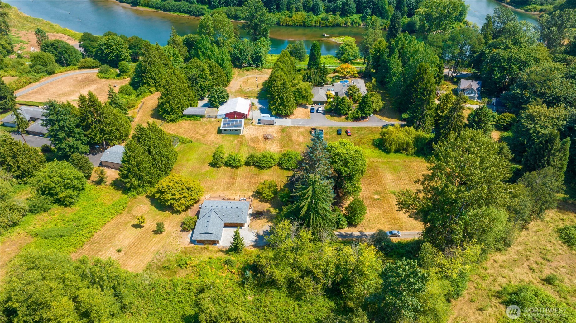 22212 High Bridge Road Monroe, WA 98272 - Photo 32 of 34 an aerial view of residential houses with outdoor space and trees all around