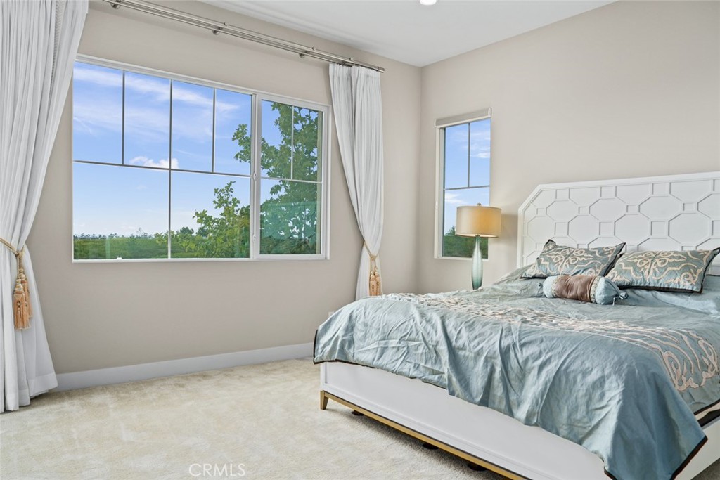 168 Perspective Irvine, CA 92618 - Photo 16 of 49 a bedroom with a bed and a window