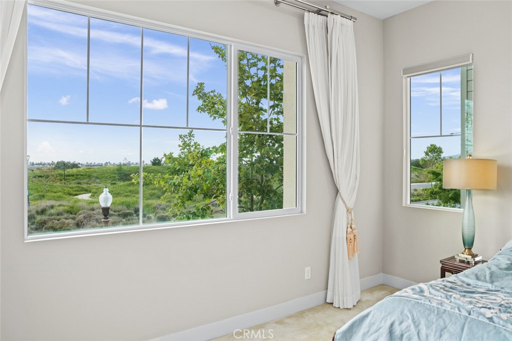 168 Perspective Irvine, CA 92618 - Photo 17 of 49 a bedroom with a bed and a window