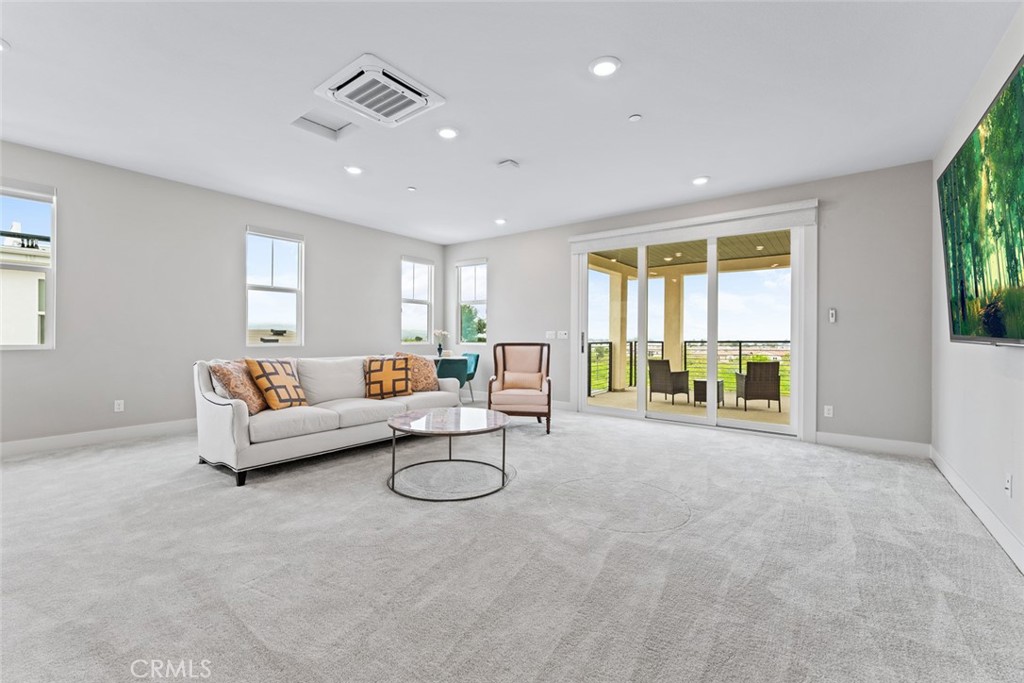 168 Perspective Irvine, CA 92618 - Photo 25 of 49 a living room with furniture and a table