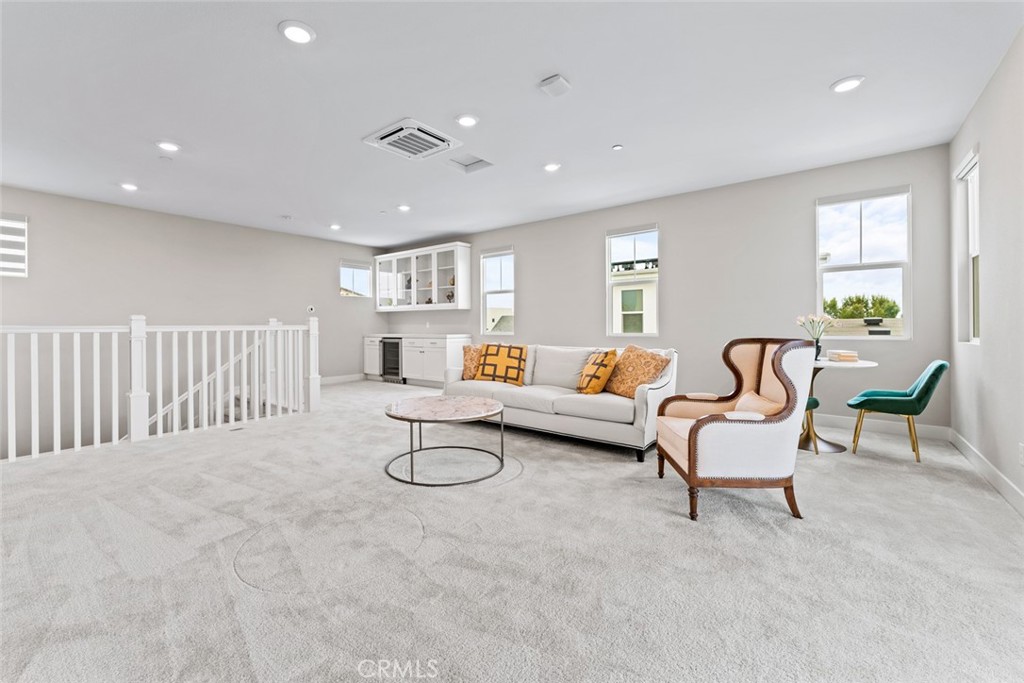 168 Perspective Irvine, CA 92618 - Photo 26 of 49 a living room with furniture and a table