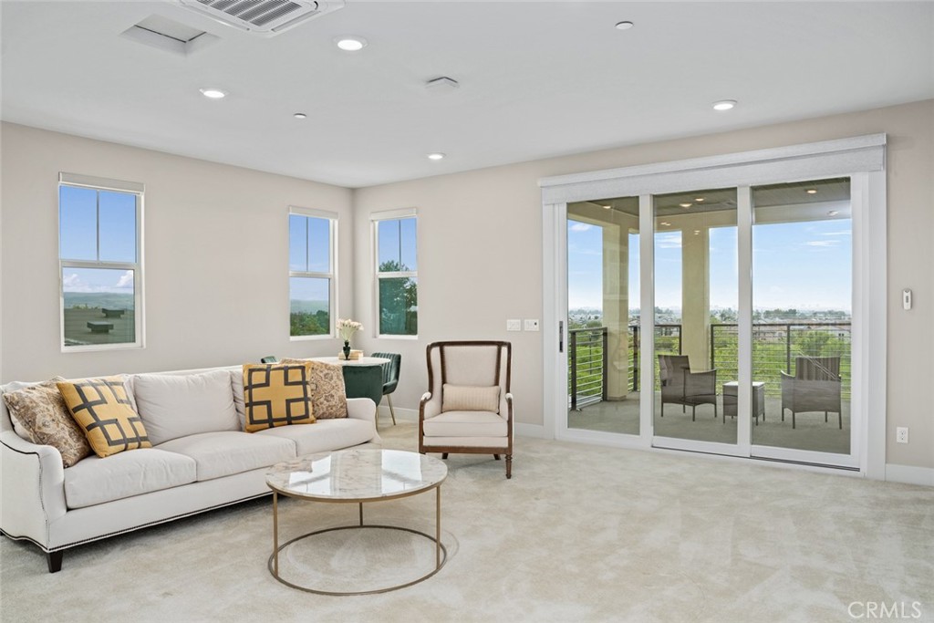 168 Perspective Irvine, CA 92618 - Photo 27 of 49 a living room with furniture and a large window