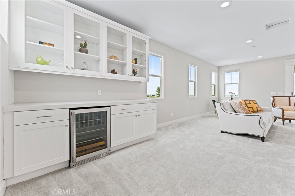 168 Perspective Irvine, CA 92618 - Photo 28 of 49 a living room with furniture a window and dresser