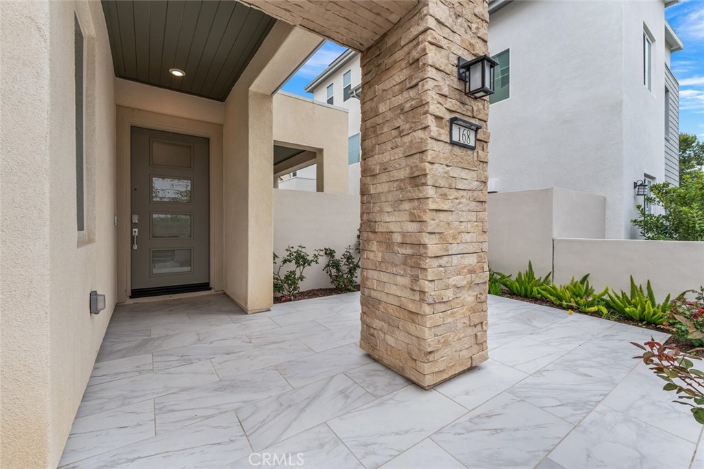 168 Perspective Irvine, CA 92618 - Photo 32 of 49 a view of entryway with flower plants