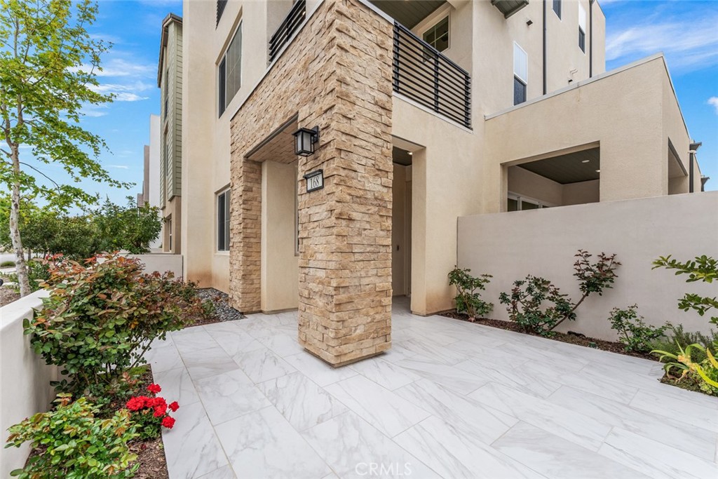 168 Perspective Irvine, CA 92618 - Photo 33 of 49 a view of a house with potted plants