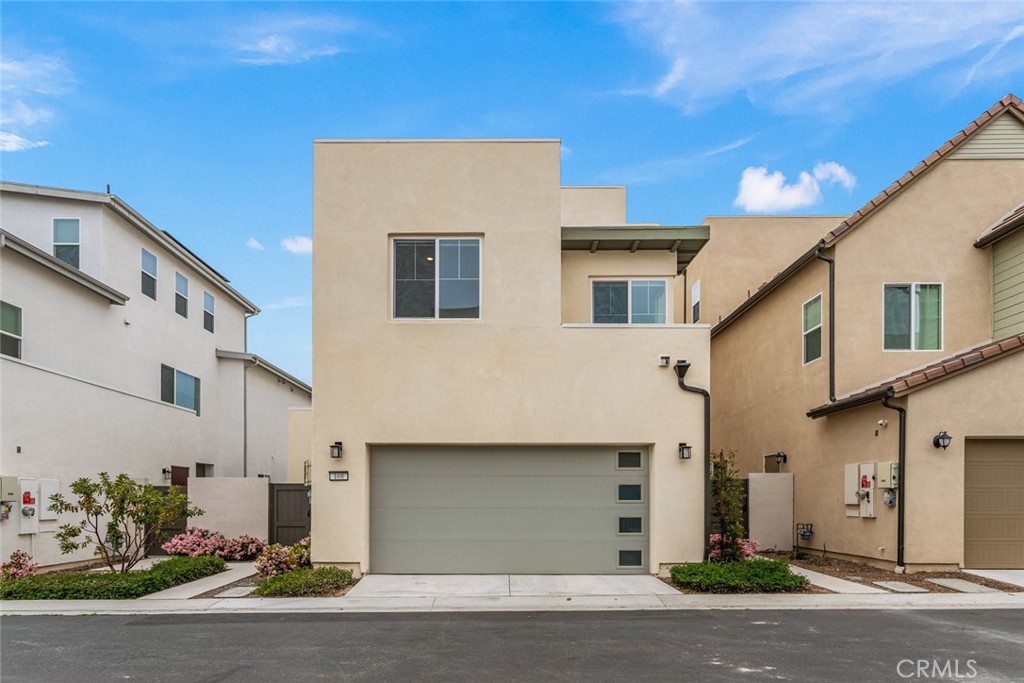 168 Perspective Irvine, CA 92618 - Photo 35 of 49 a front view of a house with a yard